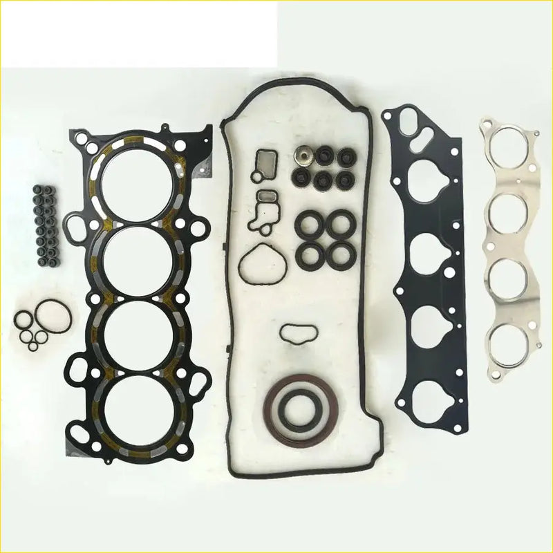 Black rubber gasket set with metal parts and seals neatly arranged for honda accord cr-v iii 24 i k24z1 metal