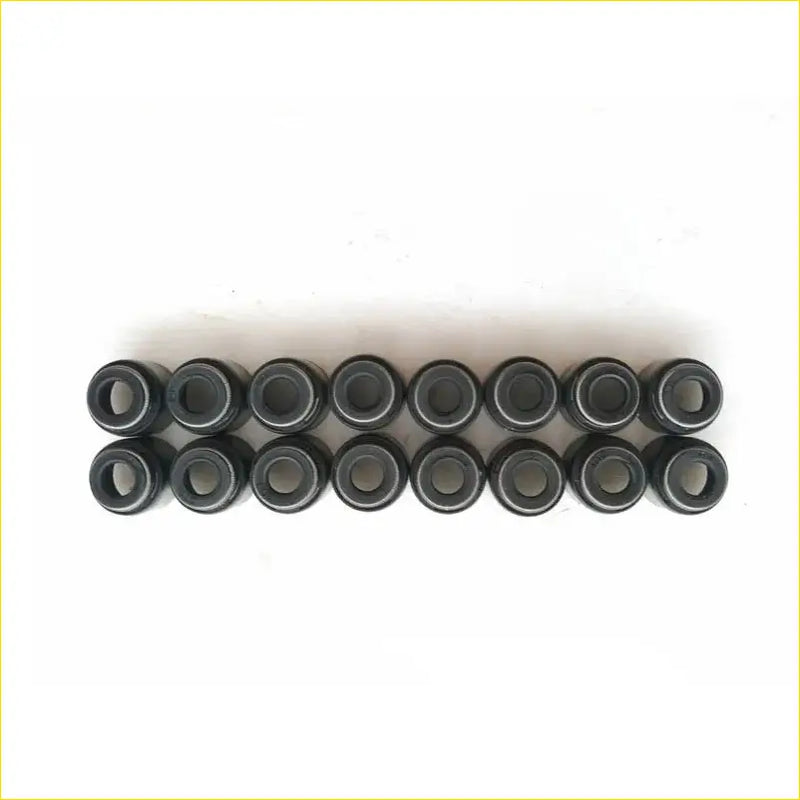 Black cylindrical metal bearing assemblies neatly arranged in two rows for gasket pro k14b valve stem oil seal suzuki swift