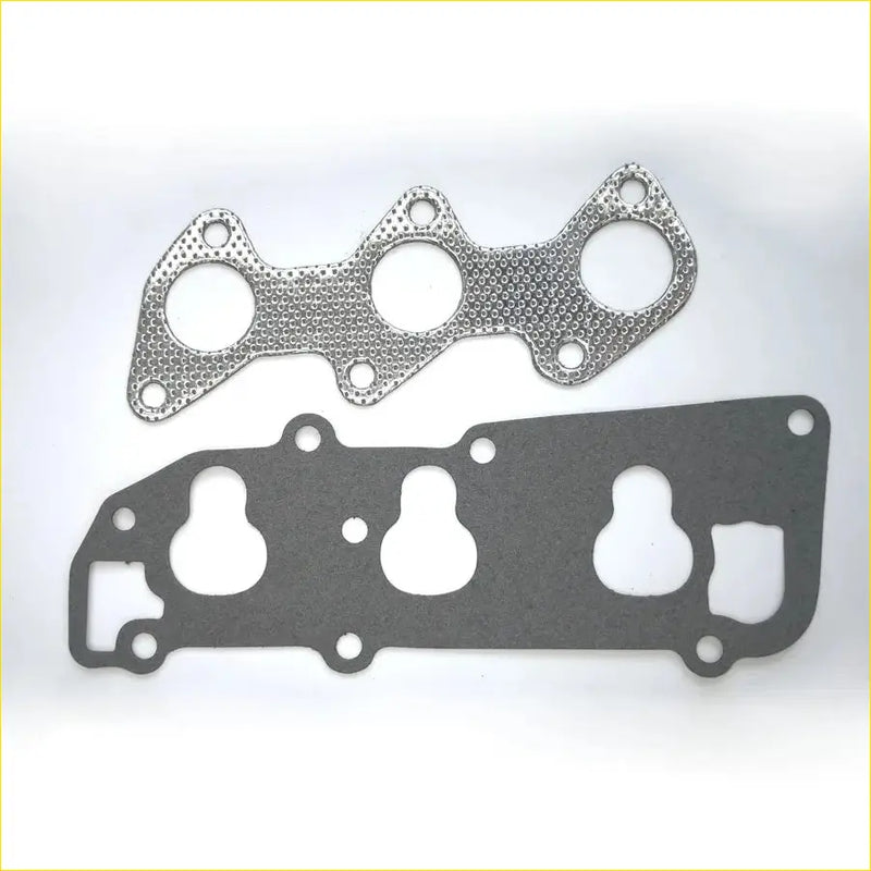 Two metallic engine head gaskets for gasket pro mitsubishi minica minicab with textured and smooth surfaces