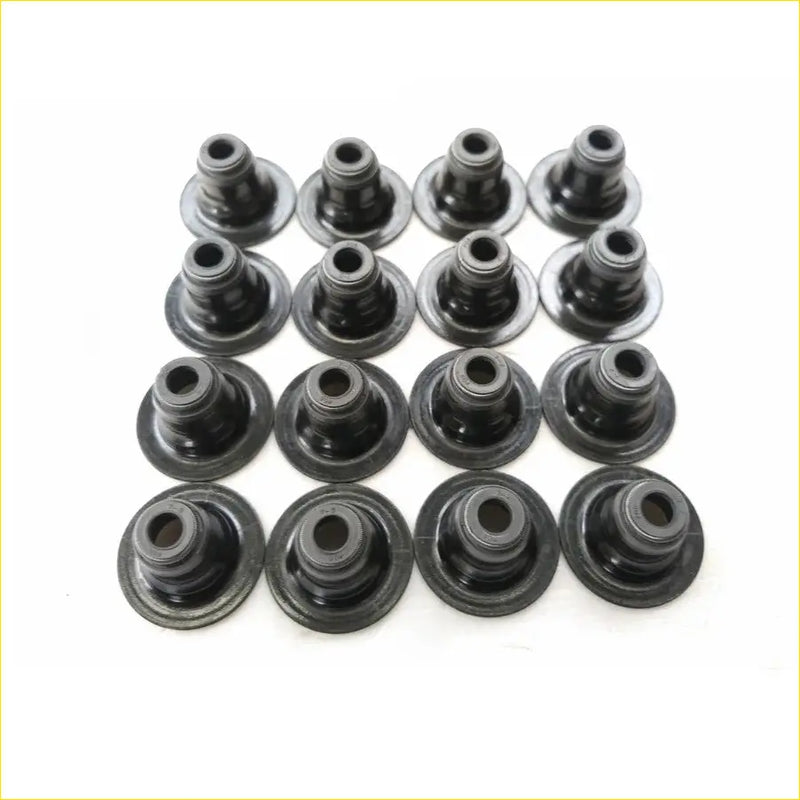 Black rubber valve stem oil seal grommets arranged in grid for gasket pro s4ph lotus l3 16pcs set