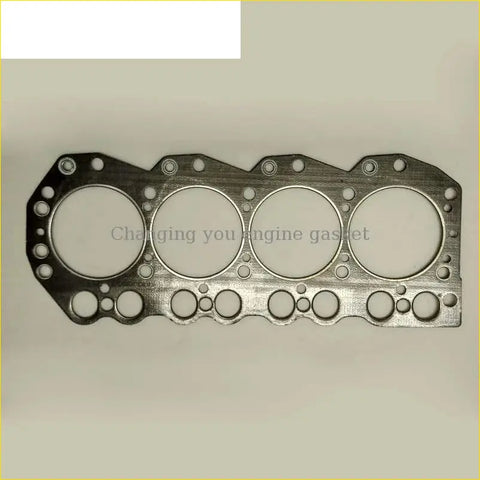Metallic silver cylinder head gasket with four large circular holes and smaller openings for nissan truck td27 d21 engine