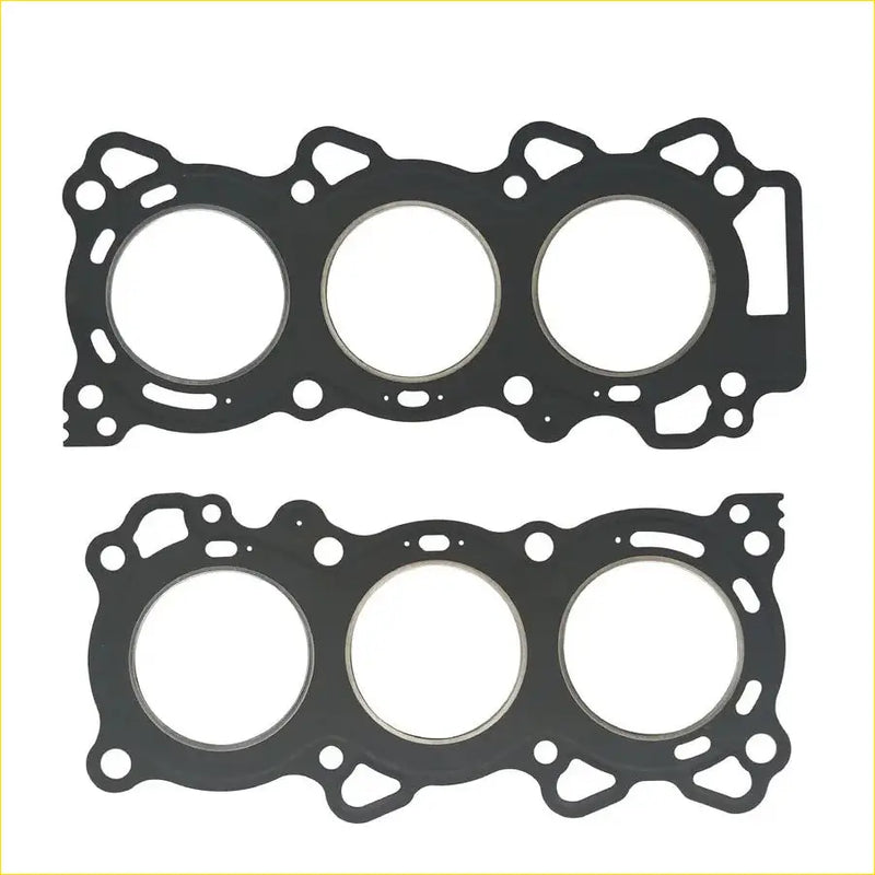 Black rubber head gasket with three circular openings and intricate cutouts for vq25de nissan maxima engine mounting