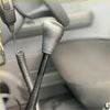 Silver textured leather gear shift knob with black shaft for gear stick extension in car interior use