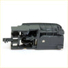 Back side of a dark gray plastic door handle latch with spring for gray door handle bezel left toyota hilux 2004-2015