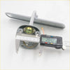 Back view of gray plastic doorbell push button with brass internal part and wiring for toyota hilux rear mirror