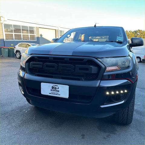 Black ford ranger px2 2016-2018 grille with bold design and red accent stripes on pickup truck front