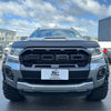 Silver ford ranger px3 wildtrak 2018-2021 with black grille and rugged off-road tires shown from front side