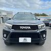 Black Toyota Hilux pickup truck with chrome grille and roof rack featuring grille for Toyota Hilux 2015-2020