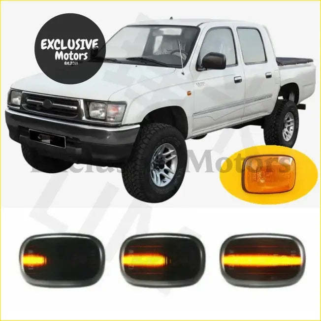 White toyota hilux pickup with black trim and chrome wheels featuring amber led guard indicators x 2 for 1988-2005 model