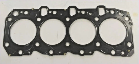 Black engine head gasket with four circular openings and textured surface for hi lux land cruiser 1993–2000