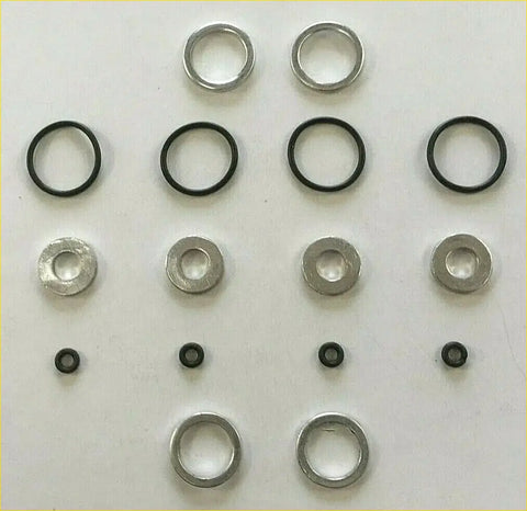 Set of metallic and black rubber washers arranged in rows for head gasket set bolts vw crafter amarok 2.0 tdi
