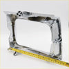 Shiny chrome metal head light door frame with molded edges and mounting points for toyota hilux 1988-1997