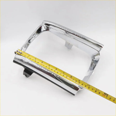 Chrome finished rectangular headlight housing with sleek reflective surface and mounting bracket for toyota hilux 2wd 85-97