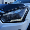Black plastic headlight cover with sleek angular design and mounting clips for isuzu d-max 2016-2020