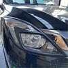 Black glossy headlight cover with sleek angular design and clear lens for mazda bt-50 2012-2020 matte finish
