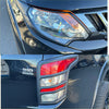 Black nissan pickup with chrome accented headlight and taillight covers for mitsubishi triton 2015-2018 back view
