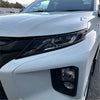 White mitsubishi triton 2019-2023 headlight cover with sleek black trim and modern led design