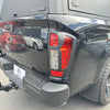 Black nissan navara 2021+ sl matte headlight and taillight covers shown from the back with sleek glossy finish