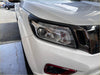 White nissan pathfinder headlight cover with chrome accents and sleek modern design for nissan navara 2021+ sl matte