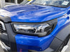 Vibrant blue toyota hilux 2021-2025 sr5 with sleek led headlight covers and black plastic trim