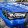 Headlight cover for blue toyota hilux 2021-2025 sr5 with sleek black trim and clear lens led lighting
