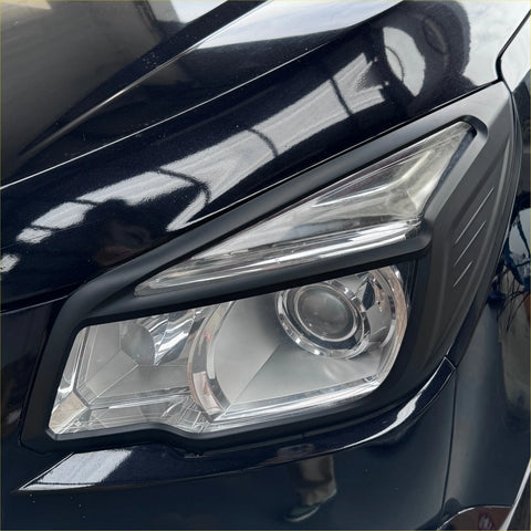 Matte black headlight covers with clear lens and chrome accents for holden colorado 2012-2016 front view