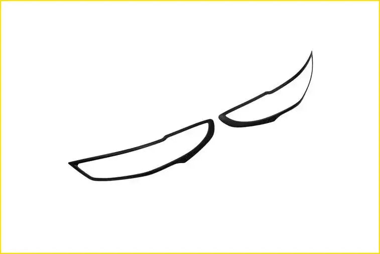 Black plastic headlight trim covers for bt50 2021 designed to surround and protect car headlights