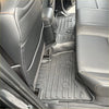 Black rubber heavy duty mat with molded ridges and circular indentations for 2024+ mitsubishi triton interior