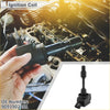 Black ignition coil pack with cylindrical body and rectangular base held in hand against engine for toyota aygo 2014-2016