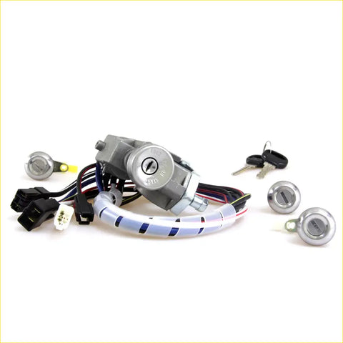 Gray ignition switch assembly with black and white wiring harness and silver key cylinders for mazda bravo lock set