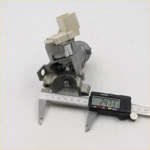 Gray metal ignition switch door lock actuator with beige plastic parts for toyota hilux 2005-2015 back side view