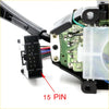 Black 15-pin electrical connector with rectangular housing attached to wiring harness on indicator wiper switch module