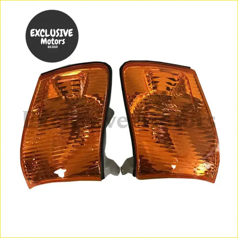 A pair of amber textured plastic side marker lights with curved design for toyota chaser gx100 jzx100 indicators park lights