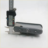 Gray plastic inner door handle for Toyota Hilux 2004-2016 showing the back with three small cylindrical connectors