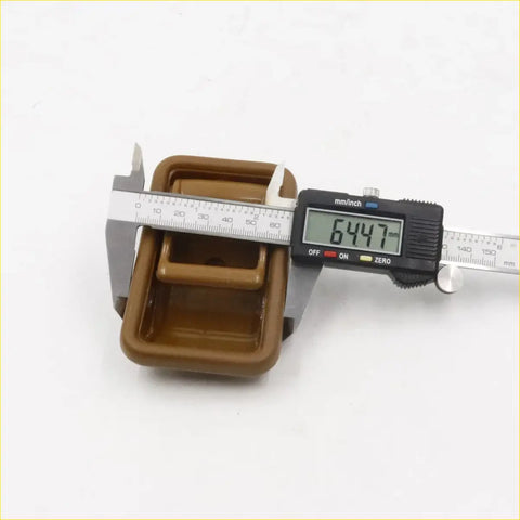 Brown plastic rectangular inner door handle with handle measuring 64.47 mm for mazda b series 1985-1998