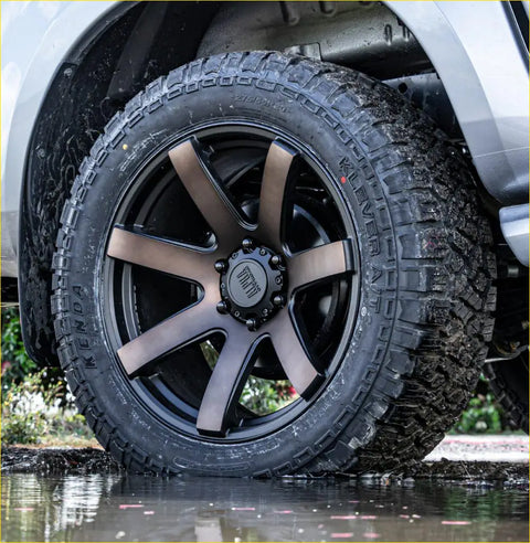 Black kenda klever at tire 265 70 r17 on matte black and bronze multi spoke alloy wheel
