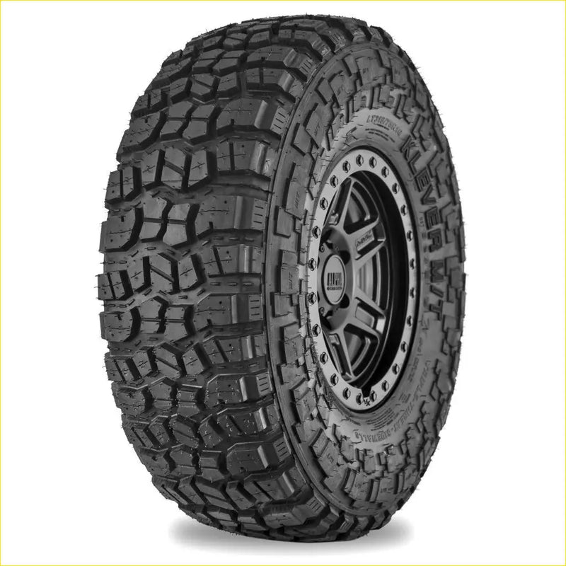 Black rubber Kenda Klever MT2 315/70 R17 off-road tire with aggressive tread on dark alloy wheel