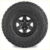 Black kenda klever mt2 33x12.5 r20 tire mounted on a black alloy wheel for off road use