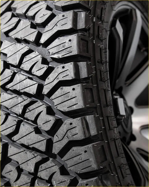 Black rubber kenda klever rt 33x12.5 r20 off-road tire with aggressive tread pattern and deep grooves for tough terrain