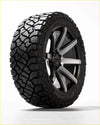 Black kenda klever rt 35x12.5 r20 all terrain tire on a two tone black and silver alloy wheel for rugged use