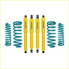 Set of four bright yellow galvanized shock absorbers with teal coils for landcruiser 80 series dobinson nitro gas lift