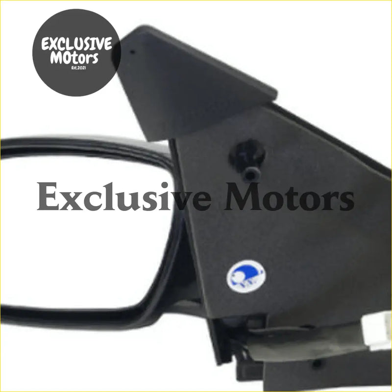 Black plastic left-hand mirror door housing with mounted camera lens for ford falcon ef/el 1994-1998 shown from back
