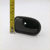 Black plastic lh door handle with smooth curved design and central mounting hole for mazda familia 323 and b2000