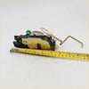 Black and gold lh door lock latch with green plastic component for toyota hilux 1997-2005 showing back side