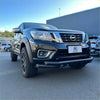 Black nissan navara with low bar nudge bar 2015-2025 and rugged front bumper with alloy wheels