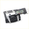 Black rubber lower spring bumper for toyota hilux 1988-1997 being measured with digital caliper