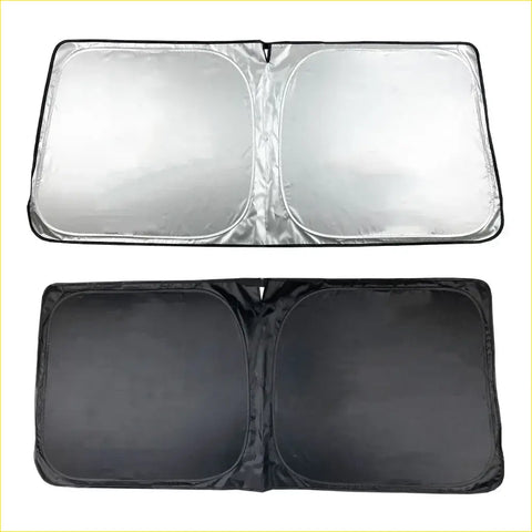 Silver reflective magnetic windscreen solar sun shade with black fabric backing and reinforced edges for 79 series cars