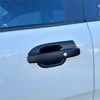 Matte black door bowl insert with a matte finish fitted on the door handle of a white 2022 ford ranger