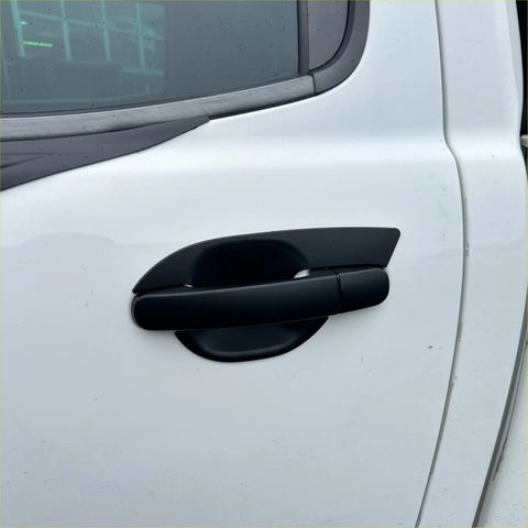 Matte black door handle cover with a matte finish for ford ranger and everest on a white vehicle