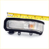 Black-framed mirror cover turn signal light for toyota hilux 2015-2018 with clear ribbed lens and amber indicator